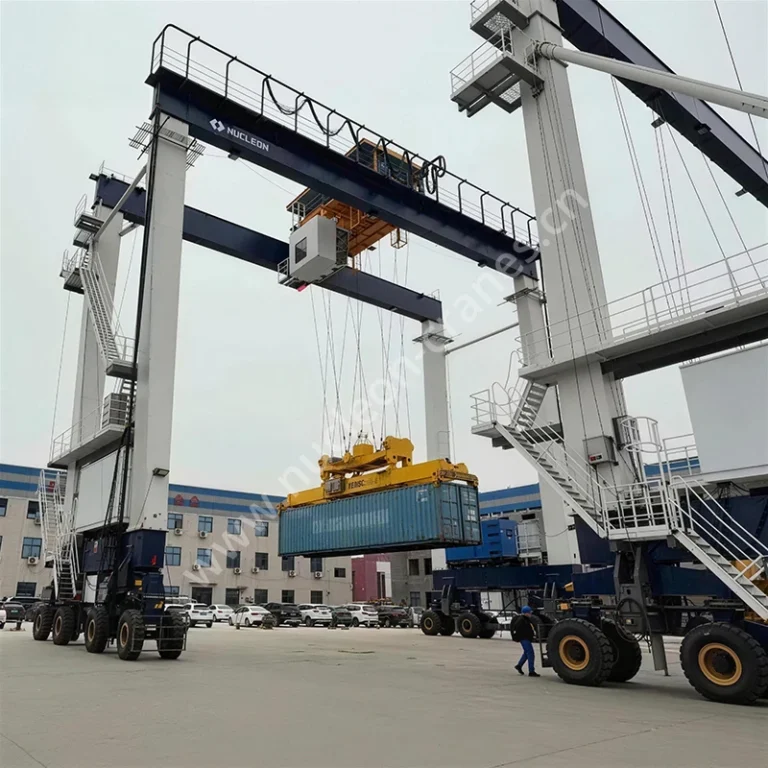 Close-up of container spreader lifting a container under Nucleon RTG41t crane