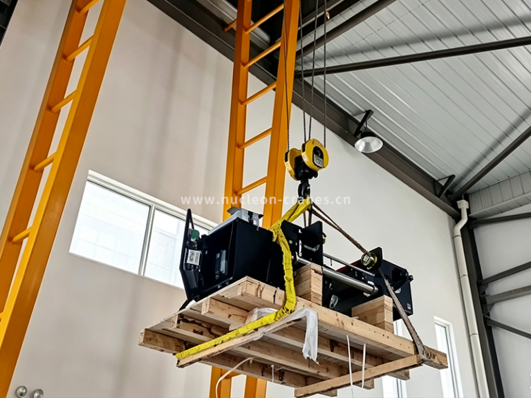 Lifting-the-electric-hoist-into-position-at-the-Italian-warehouse